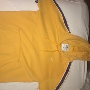 Yellow hollister hoodie with logo and red stripes